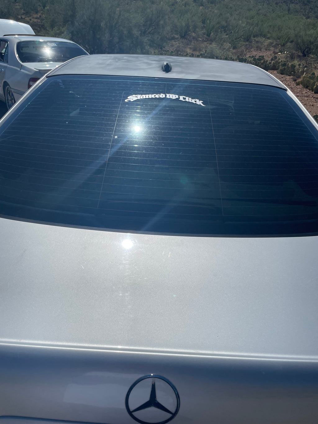 Stanced Up Click Old English decal on Infiniti quarter window