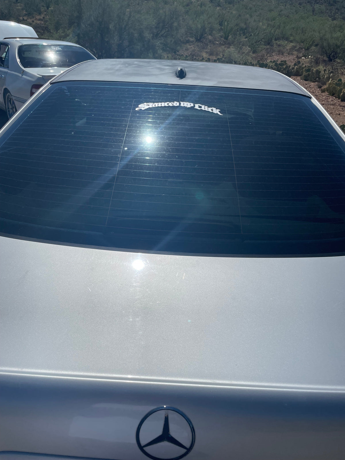 Stanced Up Click Old English decal on Infiniti quarter window