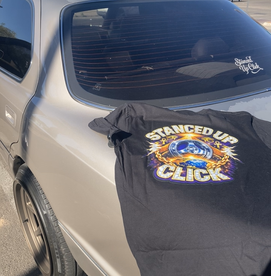 SUC Worldwide Enlighten The World Tee - back graphic on car
